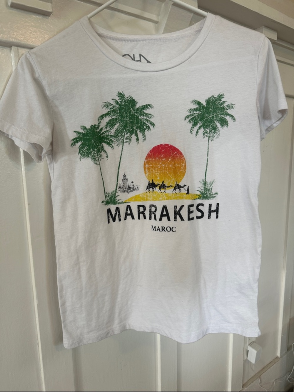 Chaser White Tee with Green Palm Trees and Red-Orange Sunset Graphic